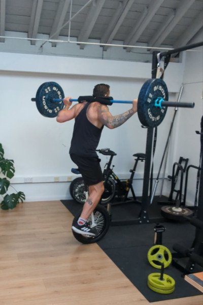 unicycle-weightlifting-jason-backwards-standing-b4-attempt.jpg